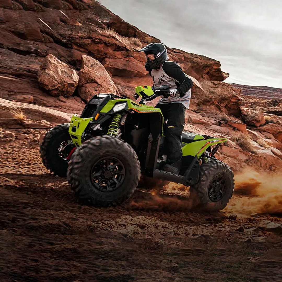 Polaris XP 1000 S 4x4 quad driving up a rocky hill off road